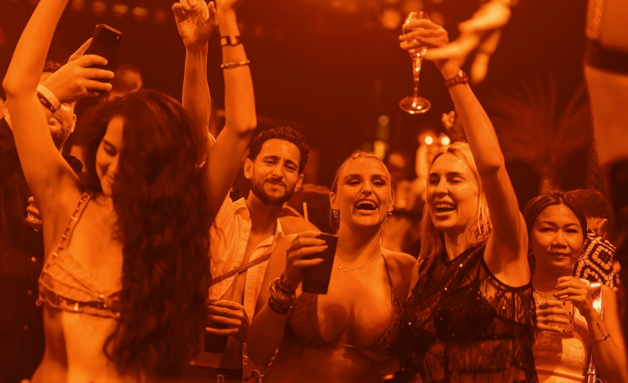 Pub crawl guide leading a fun group through Bangla Road nightlife